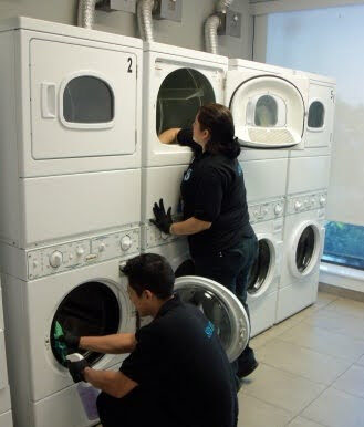 Workers cleaning the laundry facilities